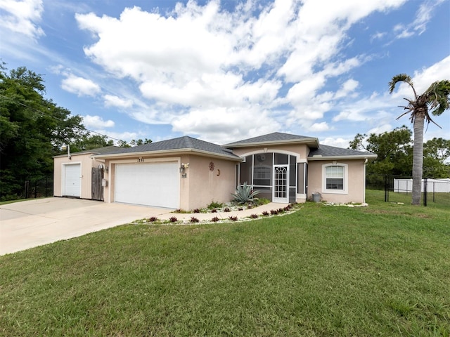 view of front facade with a garage and a front lawn