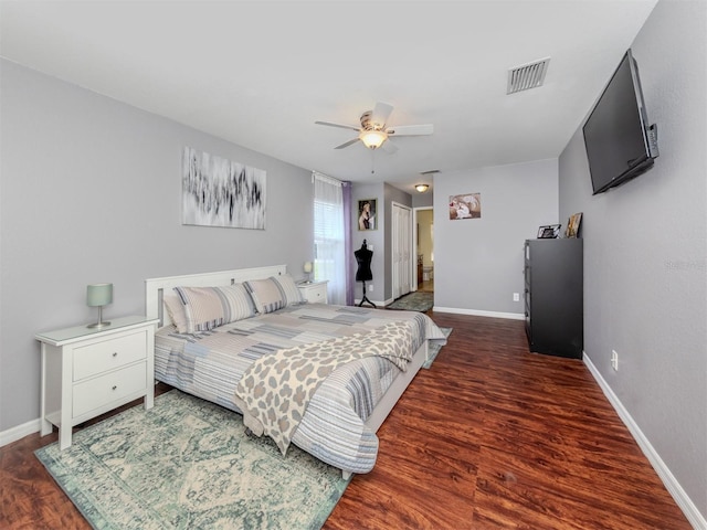 bedroom featuring ceiling fan and dark wood-type flooring