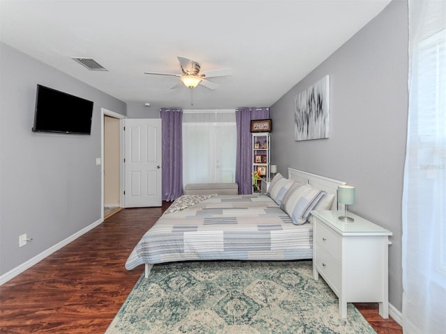 bedroom with ceiling fan and dark hardwood / wood-style floors