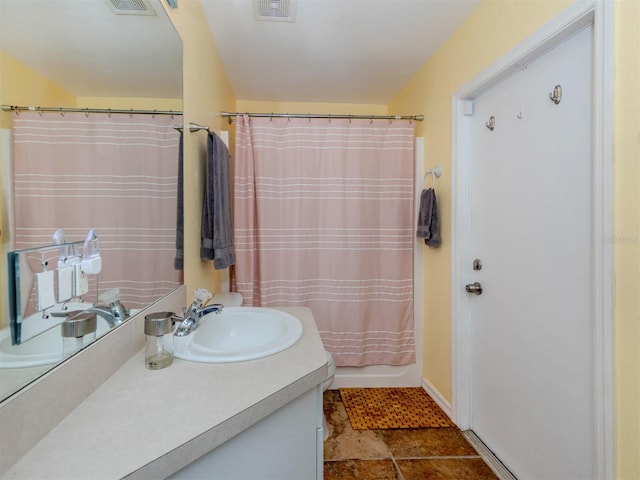 bathroom featuring vanity and shower / bath combo