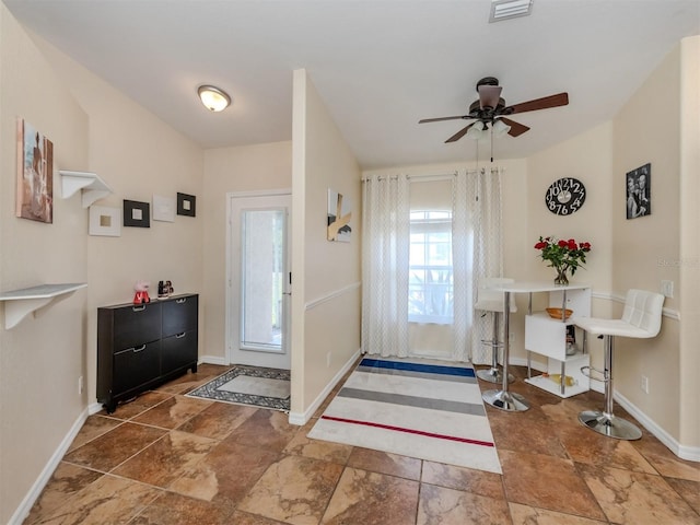 entrance foyer featuring ceiling fan