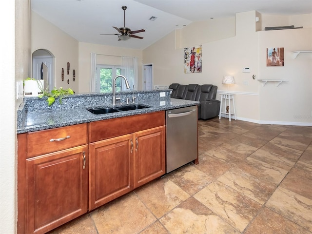 kitchen with vaulted ceiling, ceiling fan, sink, dark stone countertops, and dishwasher