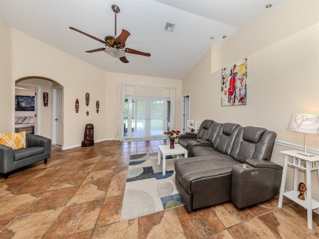 living room with ceiling fan and vaulted ceiling