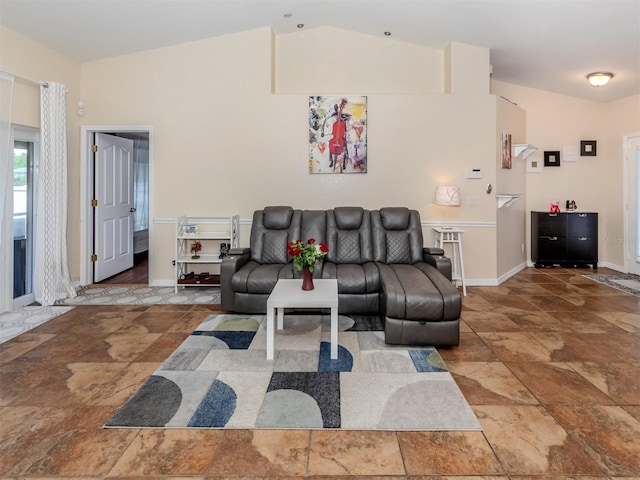 living room featuring vaulted ceiling