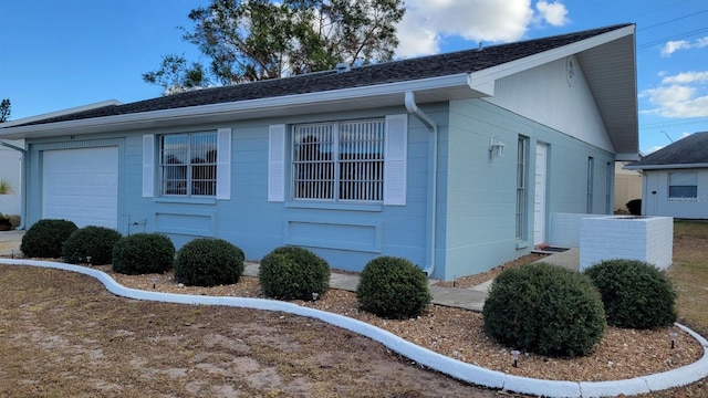 view of property exterior with a garage