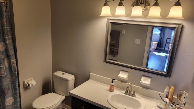 bathroom with vanity and toilet