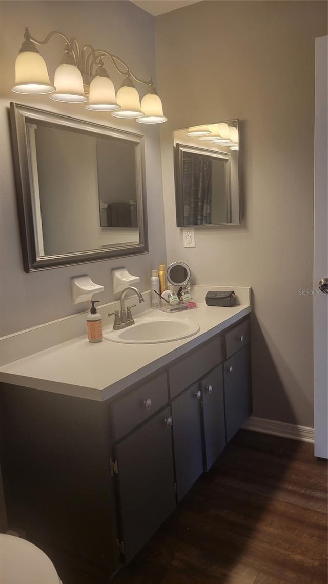 bathroom with vanity and hardwood / wood-style flooring