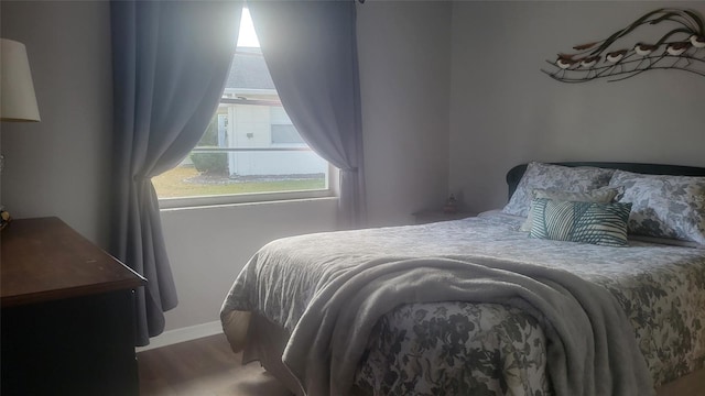 bedroom with wood-type flooring