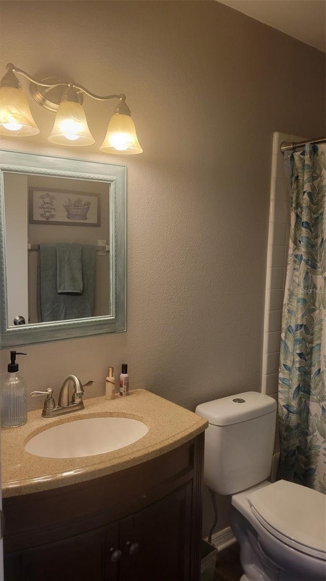 bathroom with vanity and toilet