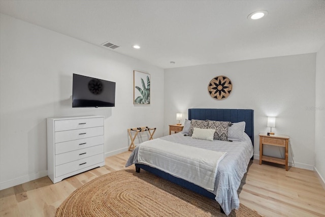 bedroom with light wood-type flooring