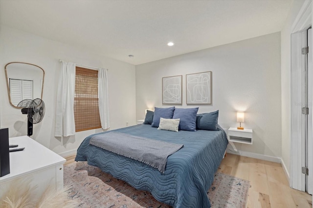 bedroom with light hardwood / wood-style floors