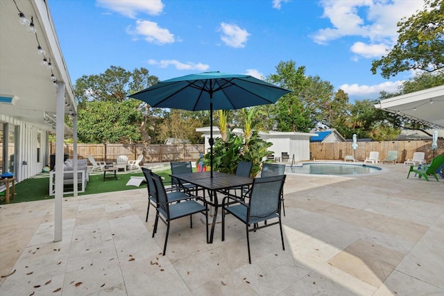 view of patio featuring a fenced in pool