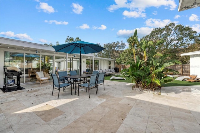 view of patio with grilling area and an outdoor hangout area