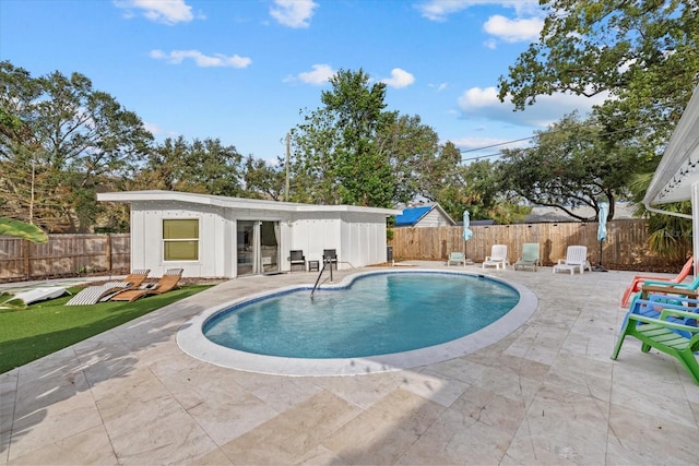 view of swimming pool with a patio area