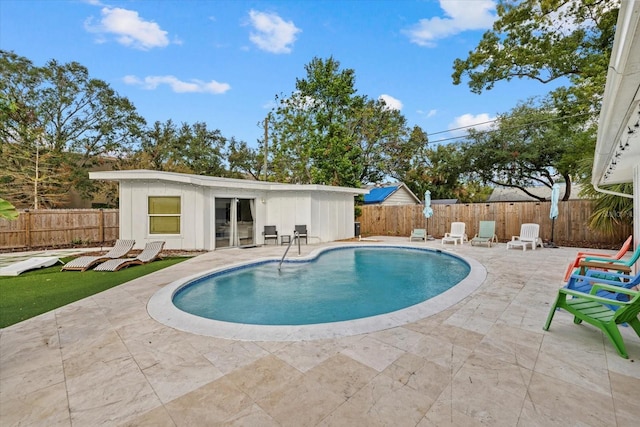 view of swimming pool with a patio