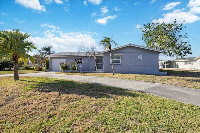 ranch-style home featuring a garage and a front lawn