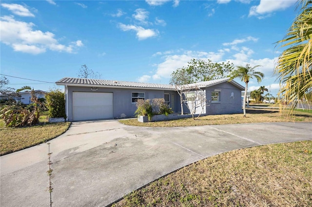 ranch-style home with a front yard and a garage