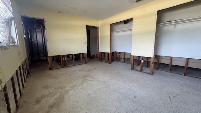 806 Arlington Rd, Palmetto, FL 34221 - unfurnished bedroom with two closets and carpet flooring