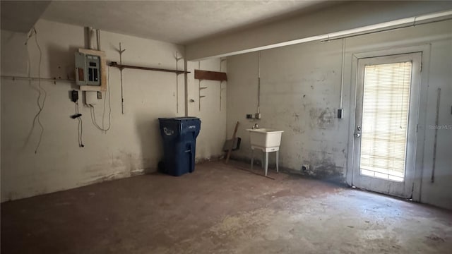 806 Arlington Rd, Palmetto, FL 34221 - below grade area with electric panel, plenty of natural light, and a sink
