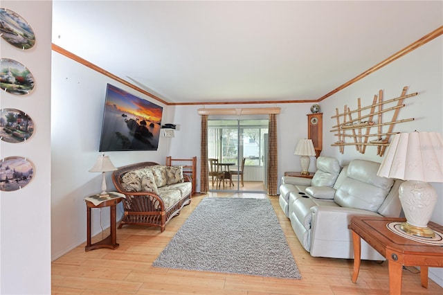 living room featuring light wood-type flooring and crown molding