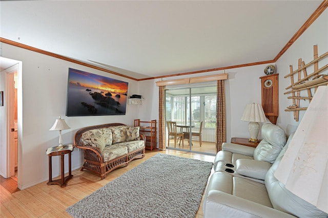 living room featuring light wood-type flooring and crown molding