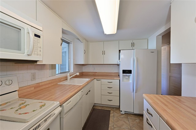 kitchen with white cabinets, white appliances, backsplash, and sink