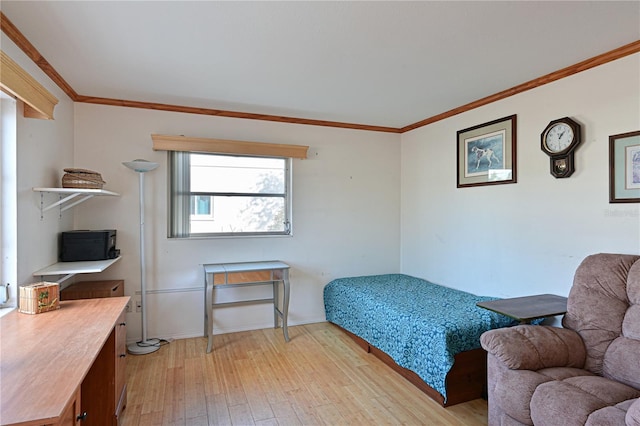 bedroom featuring crown molding and light hardwood / wood-style flooring