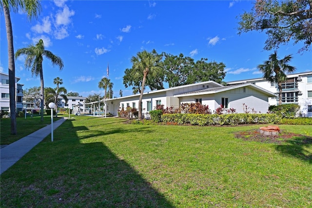 single story home featuring a front yard