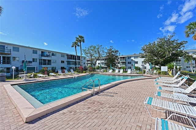 view of swimming pool with a patio area