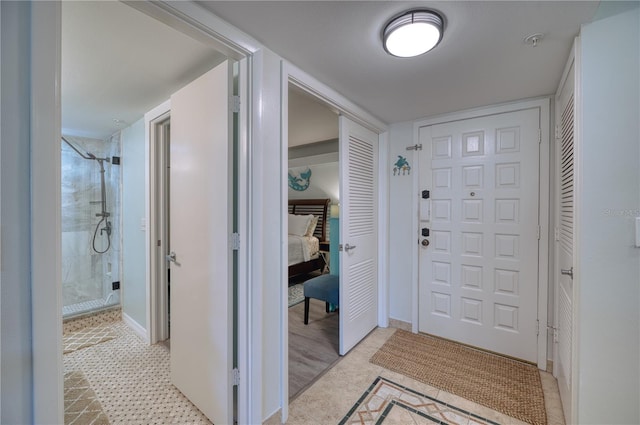 foyer with light wood-type flooring