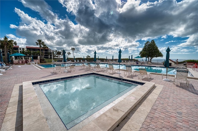 view of pool featuring a patio