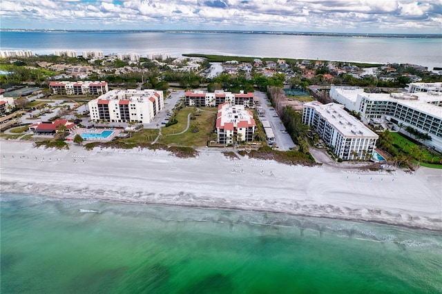 aerial view featuring a water view and a beach view