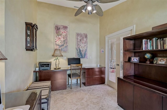 office space with french doors, ceiling fan, and light tile patterned flooring