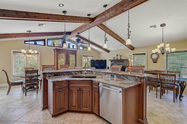 kitchen with sink, lofted ceiling with beams, stainless steel dishwasher, a notable chandelier, and decorative light fixtures