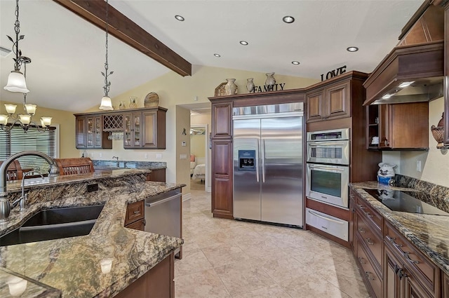 kitchen with sink, stainless steel appliances, vaulted ceiling with beams, dark stone counters, and pendant lighting