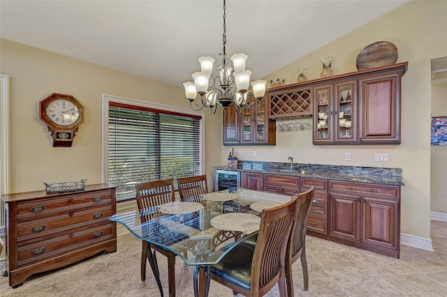 dining area with beverage cooler, wet bar, a chandelier, lofted ceiling, and light tile patterned floors