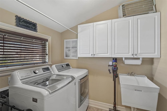 laundry room with separate washer and dryer, sink, and cabinets