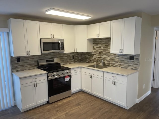 kitchen featuring sink, white cabinetry, and stainless steel appliances