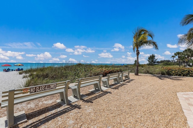 surrounding community featuring a water view