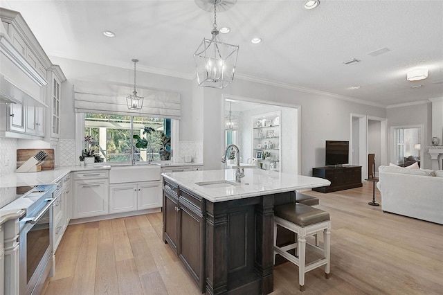 kitchen with decorative backsplash, sink, and stainless steel stove