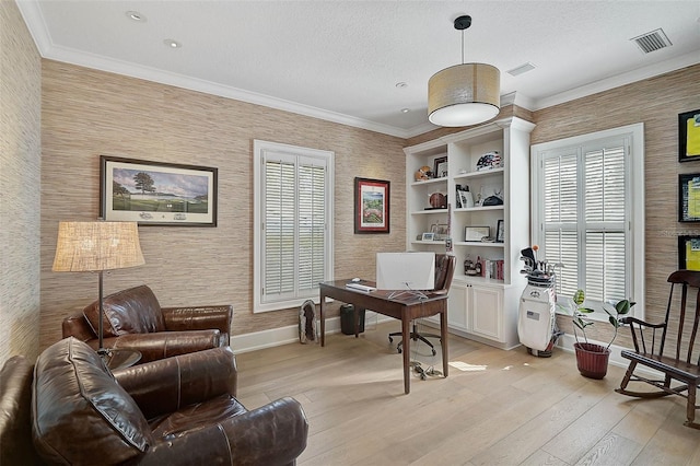 office area with ornamental molding, a textured ceiling, and light hardwood / wood-style flooring