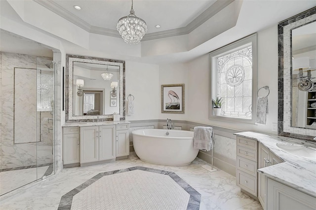 bathroom with vanity, plus walk in shower, an inviting chandelier, ornamental molding, and a tray ceiling