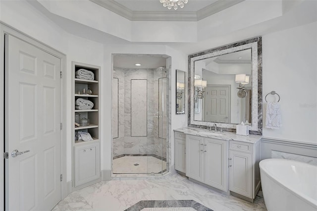 bathroom featuring built in shelves, vanity, a raised ceiling, crown molding, and plus walk in shower