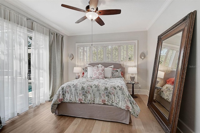 bedroom with ceiling fan, light hardwood / wood-style floors, access to exterior, and ornamental molding