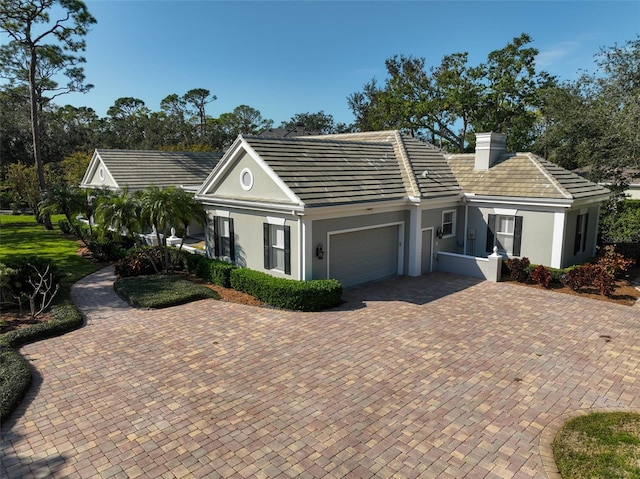 ranch-style home with a garage