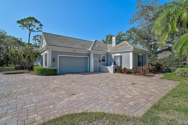 ranch-style house featuring a garage