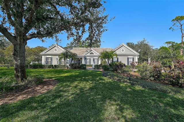 single story home with a front lawn