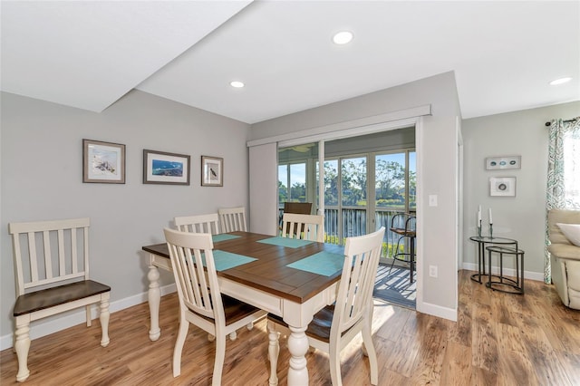 dining room featuring a healthy amount of sunlight and light wood-type flooring