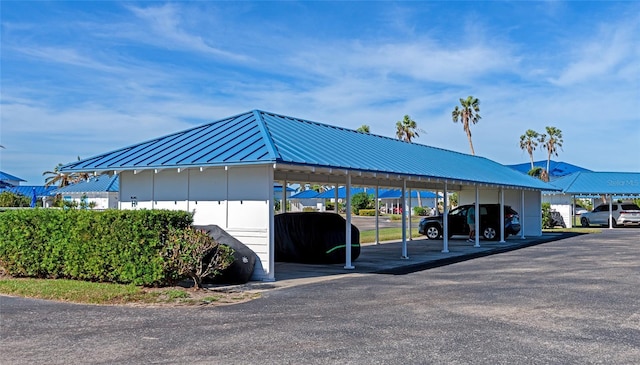 view of parking / parking lot with a carport