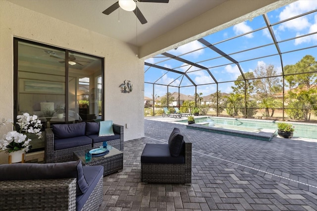 view of patio with glass enclosure, outdoor lounge area, a ceiling fan, and an outdoor pool